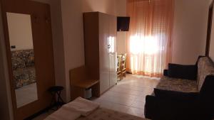 Postel nebo postele na pokoji v ubytování Hotel Patrizia