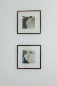 three framed pictures on a white wall at Burhan in Hamburg