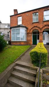 a brick house with stairs in front of it at Dublin Vacation Rentals in Dublin