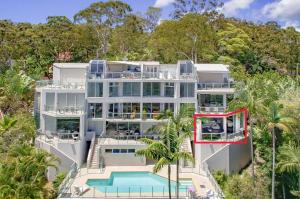 an aerial view of a house with a swimming pool at Allambi in Noosa Heads