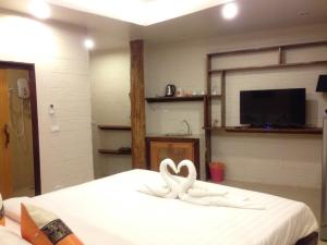 מיטה או מיטות בחדר ב-Treasure Inn Khaoyai