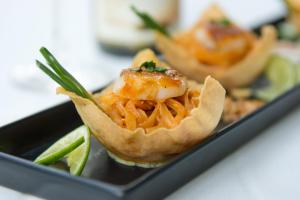 a plate of food with shrimp in a wont wrapper at Panviman Resort Koh Phangan - SHA Extra Plus in Thong Nai Pan Noi