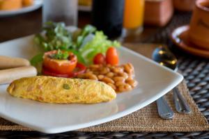 a plate of food with a burrito and a salad at Panviman Resort Koh Phangan - SHA Extra Plus in Thong Nai Pan Noi
