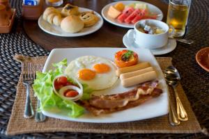 a plate of breakfast food on a table at Panviman Resort Koh Phangan - SHA Extra Plus in Thong Nai Pan Noi