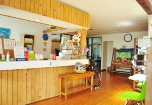 a store with a counter and a room at Rishiri Greenhill Inn in Oshidomari
