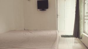 Postel nebo postele na pokoji v ubytování Pari Solata Seaview Homestay Syariah