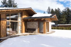 a cabin in the snow with a roof at Villa Nataly at Golf Resort in Bansko
