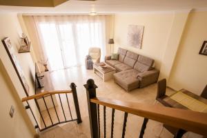 an overhead view of a living room with a couch at Residencial Playa de La Arena in Puerto de Santiago