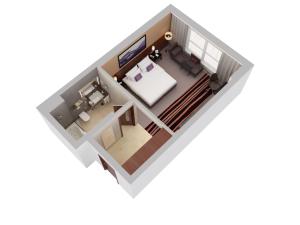 a floor plan of a bedroom at Flora Al Barsha Hotel At The Mall in Dubai