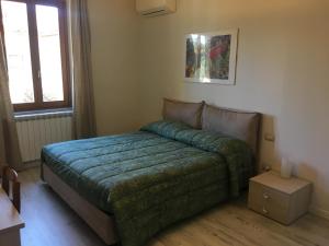 Postel nebo postele na pokoji v ubytování Guest House Il Naif