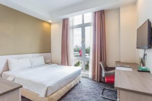 Ein Bett oder Betten in einem Zimmer der Unterkunft Scott Hotel KL Sentral