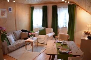 a living room with a couch and a table at Bauernhof König in Anger