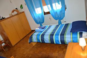 Postel nebo postele na pokoji v ubytování B&B Arcobaleno