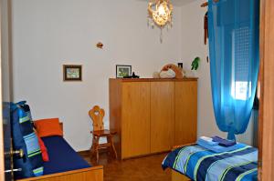Postel nebo postele na pokoji v ubytování B&B Arcobaleno + 8 fotografií