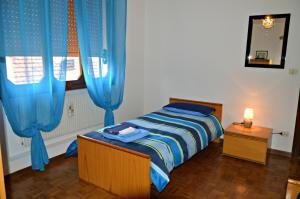 Postel nebo postele na pokoji v ubytování B&B Arcobaleno
