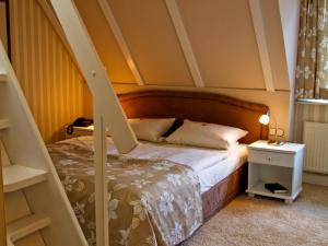 Una cama o camas en una habitación de Vogel Hotel & Appartements