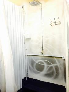 a shower in a bathroom with a shower curtain at Edm Space in Ipoh