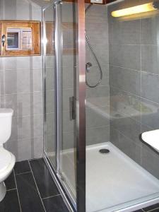 a bathroom with a shower and a toilet at Résidence Marina Livia in Serriera