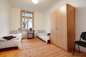 Ένα ή περισσότερα κρεβάτια σε δωμάτιο στο Riga Academic Guest House