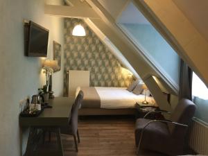 Voodi või voodid majutusasutuse Hotel Johannes Vermeer Delft toas