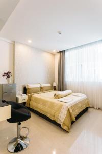 Postel nebo postele na pokoji v ubytování CA&SA Serviced Apartment