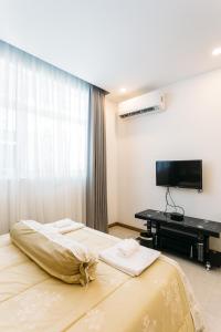 Postel nebo postele na pokoji v ubytování CA&SA Serviced Apartment