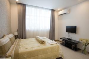 Postel nebo postele na pokoji v ubytování CA&SA Serviced Apartment