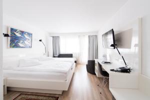 Postel nebo postele na pokoji v ubytování Hotel Hohberg "Next to BBC Arena" + 35 fotografií