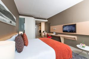 TV a/nebo společenská místnost v ubytování Noom Hotel Conakry