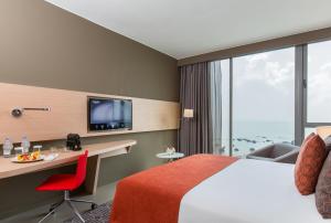 TV a/nebo společenská místnost v ubytování Noom Hotel Conakry