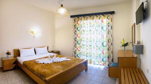 Postel nebo postele na pokoji v ubytování Nicolas Hotel