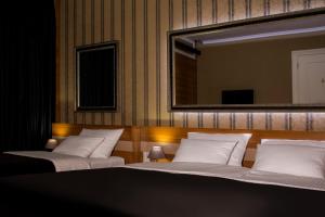 Postel nebo postele na pokoji v ubytování B&B Wimbledon Garni Concept