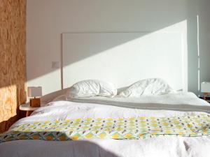 a bedroom with a bed with a large window at Superbe appartement sur la plage - Le Zénith in Palavas-les-Flots