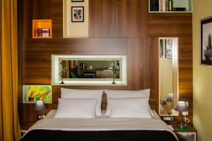 Postel nebo postele na pokoji v ubytování B&B Wimbledon Garni Concept