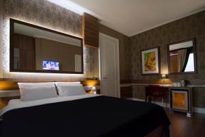 Postel nebo postele na pokoji v ubytování B&B Wimbledon Garni Concept