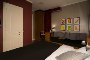 Postel nebo postele na pokoji v ubytování B&B Wimbledon Garni Concept