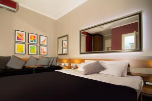 Postel nebo postele na pokoji v ubytování B&B Wimbledon Garni Concept