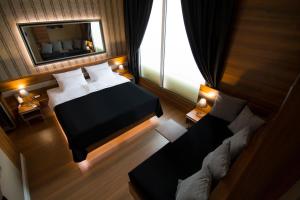 Postel nebo postele na pokoji v ubytování B&B Wimbledon Garni Concept