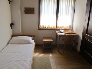 Postel nebo postele na pokoji v ubytování Casa Alpina Don Guanella