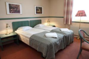 Postel nebo postele na pokoji v ubytování Hotell Älvdalen + 37 fotografií