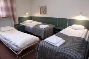Postel nebo postele na pokoji v ubytování Hotell Älvdalen