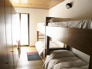 Postel nebo postele na pokoji v ubytování Casa Alpina Don Guanella