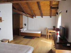 Postel nebo postele na pokoji v ubytování Casa Alpina Don Guanella