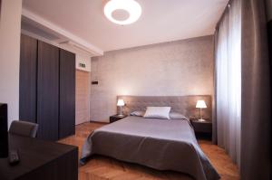 Postel nebo postele na pokoji v ubytování Hotel Maloia