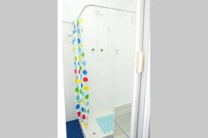 a bathroom with a shower with a mirror at Lapa I Cultura Museus e Praias no Centro GR in Rio de Janeiro