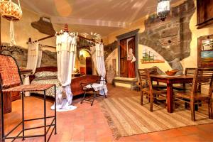 a room with a bedroom with a bed and a table at LT Lanzi - Frantoro in Viterbo