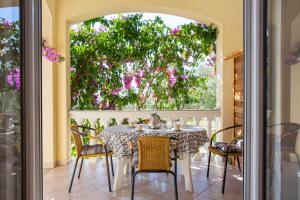 a dining room with a table and chairs at Guest House Croatia in Fažana