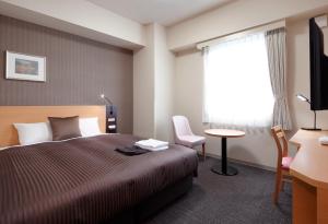 Postel nebo postele na pokoji v ubytování Hotel Super Tomari