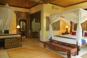 Postel nebo postele na pokoji v ubytování Alam Shanti Ubud