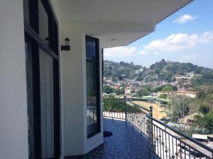 a balcony with a view of a city at Shani Residence Kandy in Kandy
